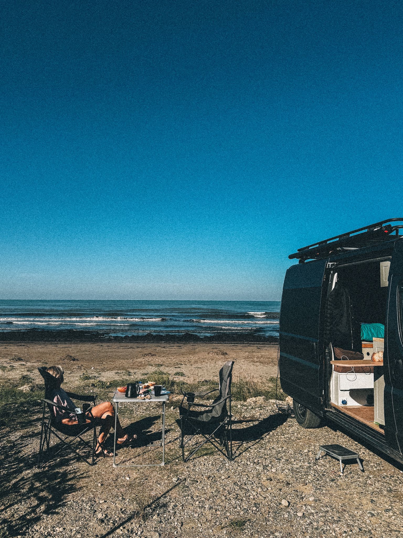 Campervan parked by the Albanian coast during a road trip